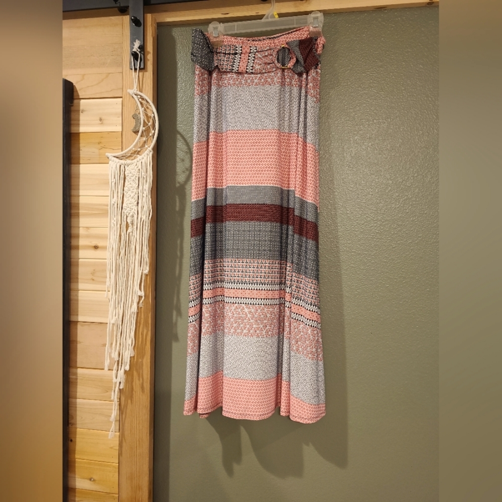 Floor length skirt with pink, black and white designs, attached belt look.